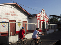 People ride bicycles in the streets of the city known as the city of bicycles, located at the mouth of the Amazon River, in Afua, Para, Braz...