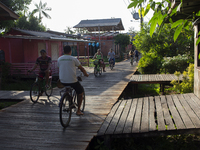 People ride bicycles in the streets of the city known as the city of bicycles, located at the mouth of the Amazon River, in Afua, Para, Braz...