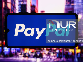 PayPal logo is screened on a mobile phone for illustration photo. Krakow, Poland on October 17th, 2024. (