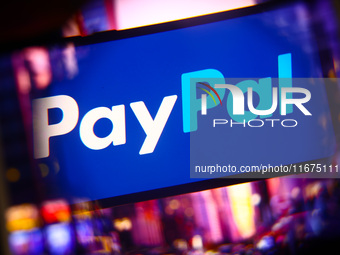 PayPal logo is screened on a mobile phone for illustration photo. Krakow, Poland on October 17th, 2024. (