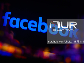 Facebook logo is screened on a mobile phone for illustration photo. Krakow, Poland on October 17th, 2024. (