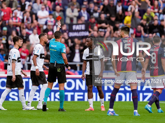 Woyo Coulibaly of Parma Calcio 1903 receives a red card during the Serie A Enilive match between Bologna FC and Parma Calcio 1903 at Stadio...