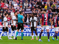 Woyo Coulibaly of Parma Calcio 1903 receives a red card during the Serie A Enilive match between Bologna FC and Parma Calcio 1903 at Stadio...