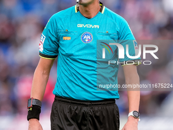 Referee Marco Di Bello looks on during the Serie A Enilive match between Bologna FC and Parma Calcio 1903 at Stadio Renato Dall'Ara on Octob...