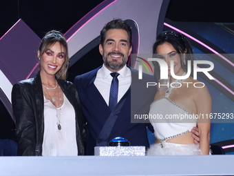 (L-R) Anahi Puente, Omar Chaparro, and Martha Higareda pose for photos during a press conference to promote the launch of ?Quien es La Masca...