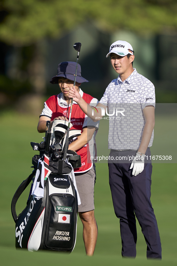 Rikuya Hoshino of Japan talks with his caddie on the 12th hole on day one of the Estrella Damm N.A. Andalucia Masters 2024 at Real Club de G...