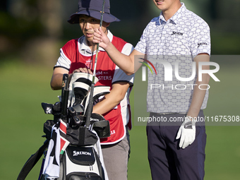 Rikuya Hoshino of Japan talks with his caddie on the 12th hole on day one of the Estrella Damm N.A. Andalucia Masters 2024 at Real Club de G...