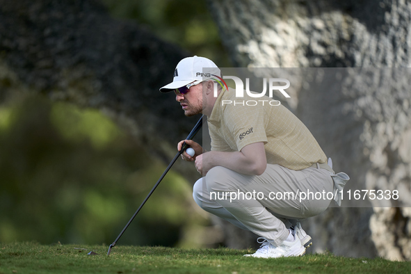 Connor Syme of Scotland studies his shot on the 14th green on day one of the Estrella Damm N.A. Andalucia Masters 2024 at Real Club de Golf...