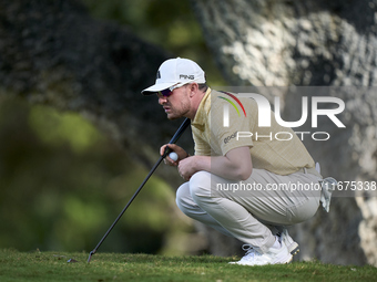 Connor Syme of Scotland studies his shot on the 14th green on day one of the Estrella Damm N.A. Andalucia Masters 2024 at Real Club de Golf...