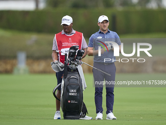 Lukas Nemecz of Austria talks with his caddie on the 14th hole on day one of the Estrella Damm N.A. Andalucia Masters 2024 at Real Club de G...