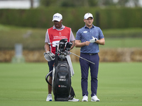 Lukas Nemecz of Austria talks with his caddie on the 14th hole on day one of the Estrella Damm N.A. Andalucia Masters 2024 at Real Club de G...