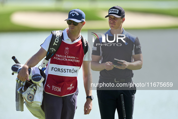 Calum Hill of Scotland talks with his caddie on the 16th green on day one of the Estrella Damm N.A. Andalucia Masters 2024 at Real Club de G...