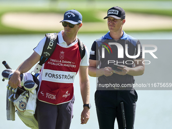 Calum Hill of Scotland talks with his caddie on the 16th green on day one of the Estrella Damm N.A. Andalucia Masters 2024 at Real Club de G...