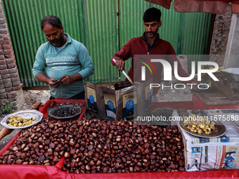 Vendors sell chestnuts and wait for customers in Srinagar, Jammu and Kashmir, India, on October 17, 2024. (