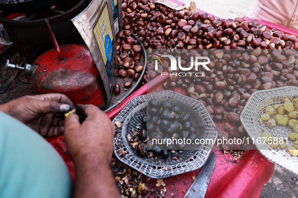 Vendors sell chestnuts and wait for customers in Srinagar, Jammu and Kashmir, India, on October 17, 2024. 