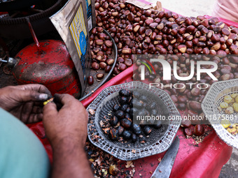 Vendors sell chestnuts and wait for customers in Srinagar, Jammu and Kashmir, India, on October 17, 2024. (