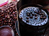 Vendors sell chestnuts and wait for customers in Srinagar, Jammu and Kashmir, India, on October 17, 2024. (