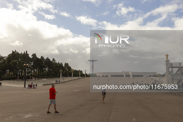 In Lisbon, Portugal, on October 17, 2024, people walk inside the Sanctuary of Fatima. Fatima becomes a pilgrimage destination for migrants,...