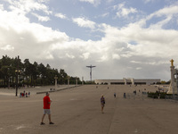 In Lisbon, Portugal, on October 17, 2024, people walk inside the Sanctuary of Fatima. Fatima becomes a pilgrimage destination for migrants,...