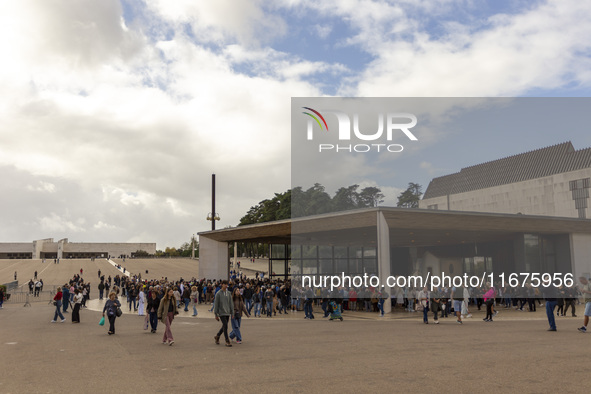 In Lisbon, Portugal, on October 17, 2024, people walk inside the Sanctuary of Fatima. Fatima becomes a pilgrimage destination for migrants,...