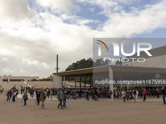 In Lisbon, Portugal, on October 17, 2024, people walk inside the Sanctuary of Fatima. Fatima becomes a pilgrimage destination for migrants,...