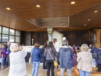 In Lisbon, Portugal, on October 17, 2024, people take pictures of the image of the Virgin inside the Sanctuary of Fatima. Fatima becomes a p...