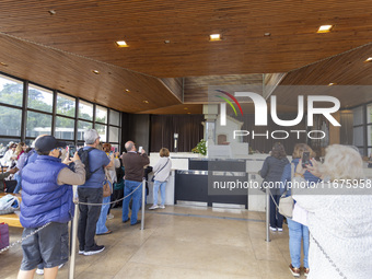 In Lisbon, Portugal, on October 17, 2024, people take pictures of the image of the Virgin inside the chapel of the Sanctuary of Fatima. Fati...