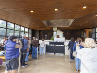 In Lisbon, Portugal, on October 17, 2024, people take pictures of the image of the Virgin inside the chapel of the Sanctuary of Fatima. Fati...