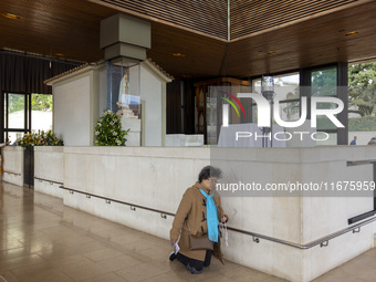 In Lisbon, Portugal, on October 17, 2024, a person walks on her knees near the image of the Virgin inside the chapel of the Sanctuary of Fat...