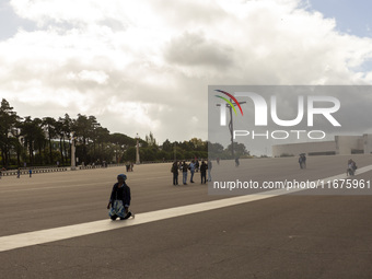 In Lisbon, Portugal, on October 17, 2024, a person walks on her knees near the chapel of the Sanctuary of Fatima. Fatima becomes a pilgrimag...