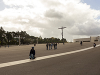 In Lisbon, Portugal, on October 17, 2024, a person walks on her knees near the chapel of the Sanctuary of Fatima. Fatima becomes a pilgrimag...