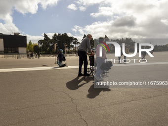 In Lisbon, Portugal, on October 17, 2024, a person walks on her knees near the chapel of the Sanctuary of Fatima. Fatima becomes a pilgrimag...