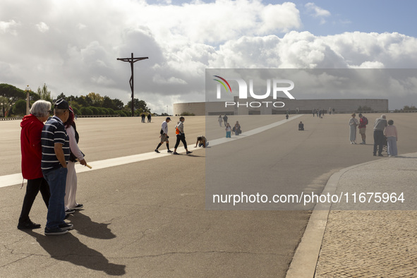 In Lisbon, Portugal, on October 17, 2024, a person walks on her knees near the chapel of the Sanctuary of Fatima. Fatima becomes a pilgrimag...