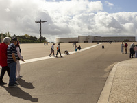 In Lisbon, Portugal, on October 17, 2024, a person walks on her knees near the chapel of the Sanctuary of Fatima. Fatima becomes a pilgrimag...