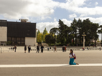 In Lisbon, Portugal, on October 17, 2024, a person walks on her knees near the chapel of the Sanctuary of Fatima. Fatima becomes a pilgrimag...