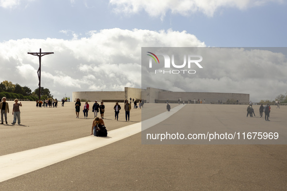 In Lisbon, Portugal, on October 17, 2024, a person walks on her knees near the chapel of the Sanctuary of Fatima. Fatima becomes a pilgrimag...