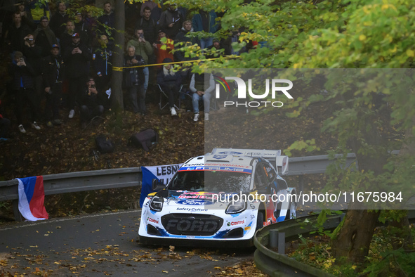 Driver Gregoire Munster and co-driver Louis Louka of the M-Sport Ford World Rally Team in a Ford Puma Rally1 Hybrid face the first day of th...