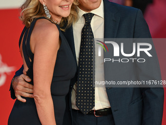 Claudia Gerini and Riccardo Sangiuliano attend the ''U.S. Palmese'' red carpet during the 19th Rome Film Festival at Auditorium Parco Della...