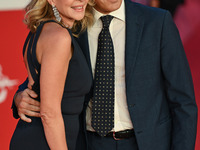 Claudia Gerini and Riccardo Sangiuliano attend the ''U.S. Palmese'' red carpet during the 19th Rome Film Festival at Auditorium Parco Della...