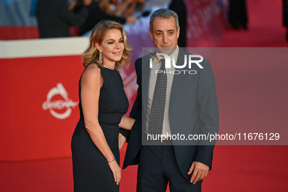 Claudia Gerini and Riccardo Sangiuliano attend the ''U.S. Palmese'' red carpet during the 19th Rome Film Festival at Auditorium Parco Della...