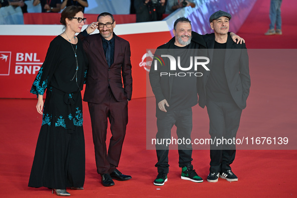 (L-R) A guest, Antonio Manetti, Marco Manetti, and a guest attend the ''U.S. Palmese'' red carpet during the 19th Rome Film Festival at Audi...