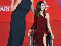 Claudia Gerini and a guest attend the ''U.S. Palmese'' red carpet during the 19th Rome Film Festival at Auditorium Parco Della Musica in Rom...