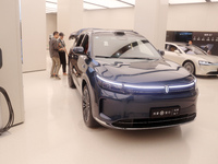 A customer experiences a smart car with Harmony OS autonomous driving technology at Huawei's flagship store in Shanghai, China, on October 1...