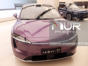 A smart car with Harmony OS autonomous driving technology is seen at Huawei's flagship store in Shanghai, China, on October 15, 2024. (