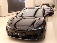 A smart car with Harmony OS autonomous driving technology is seen at Huawei's flagship store in Shanghai, China, on October 15, 2024. (