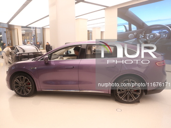 A smart car with Harmony OS autonomous driving technology is seen at Huawei's flagship store in Shanghai, China, on October 15, 2024. (