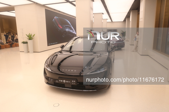 A smart car with Harmony OS autonomous driving technology is seen at Huawei's flagship store in Shanghai, China, on October 15, 2024. 