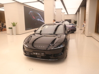 A smart car with Harmony OS autonomous driving technology is seen at Huawei's flagship store in Shanghai, China, on October 15, 2024. (