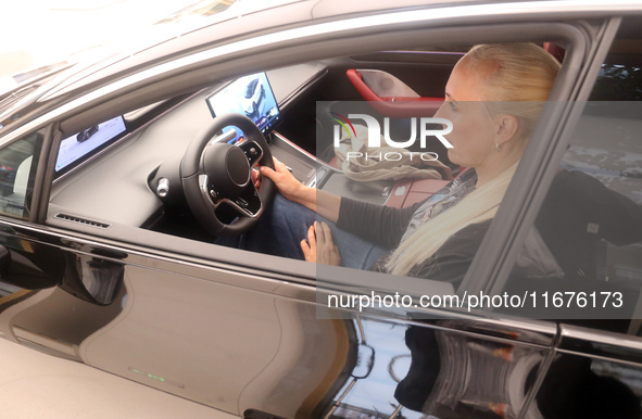 A customer experiences a smart car with Harmony OS autonomous driving technology at Huawei's flagship store in Shanghai, China, on October 1...