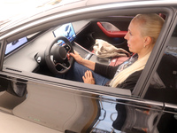 A customer experiences a smart car with Harmony OS autonomous driving technology at Huawei's flagship store in Shanghai, China, on October 1...